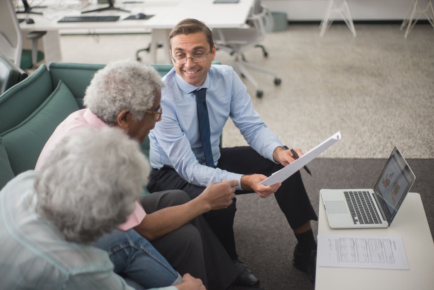 An advisor talking a couple through their plan documents